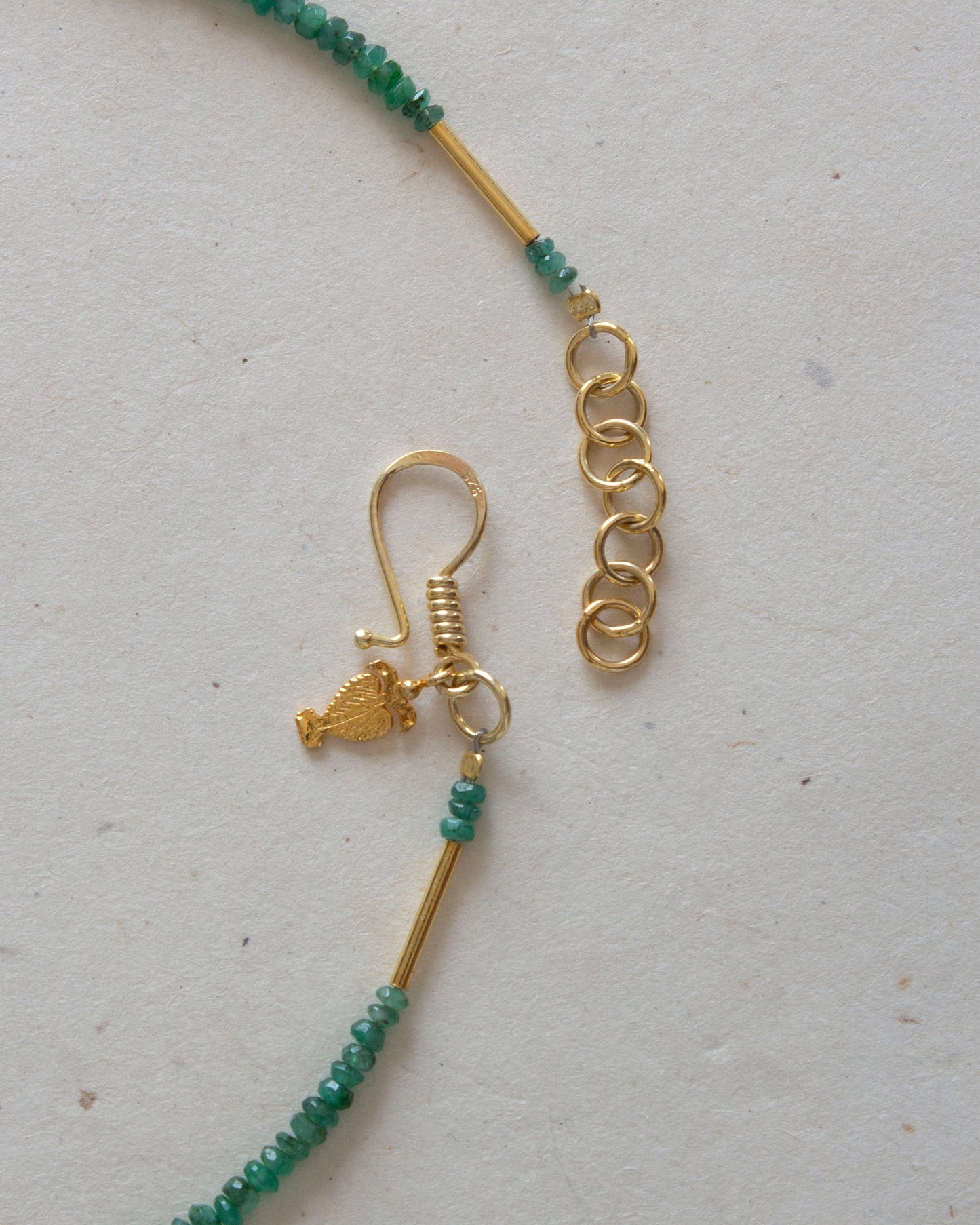 Roman Hook detail emerald necklace
