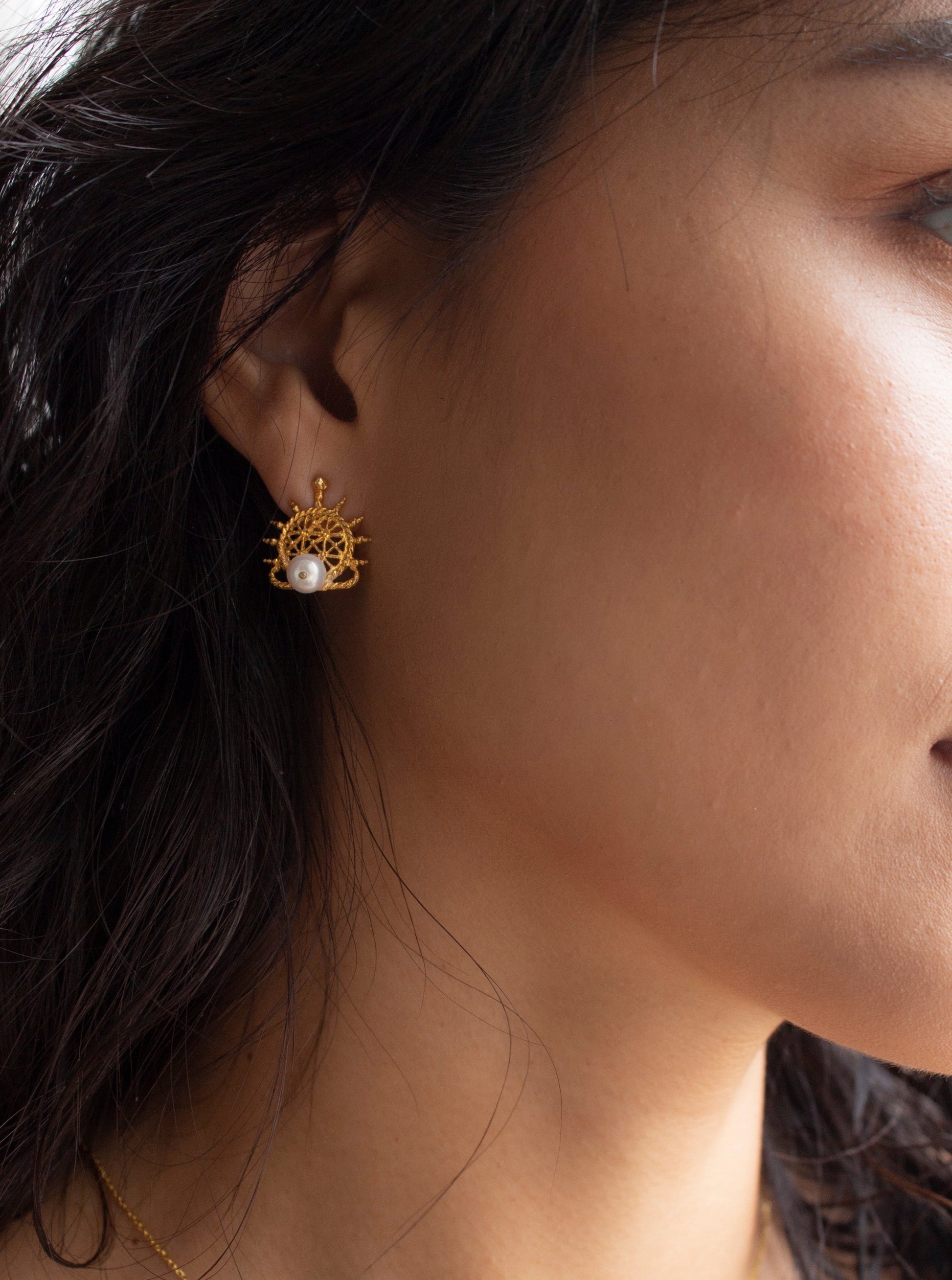 Hittite sun disk earring with pearl