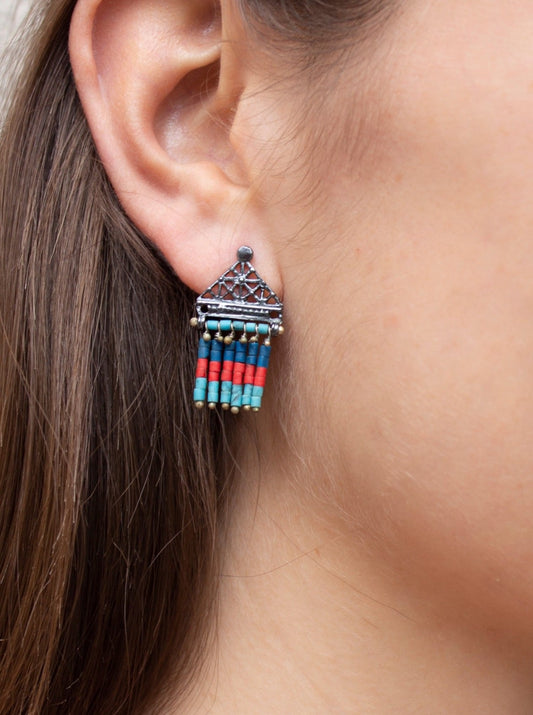 Girl wearing Oceanid polygon with lapis, coral and turquoise