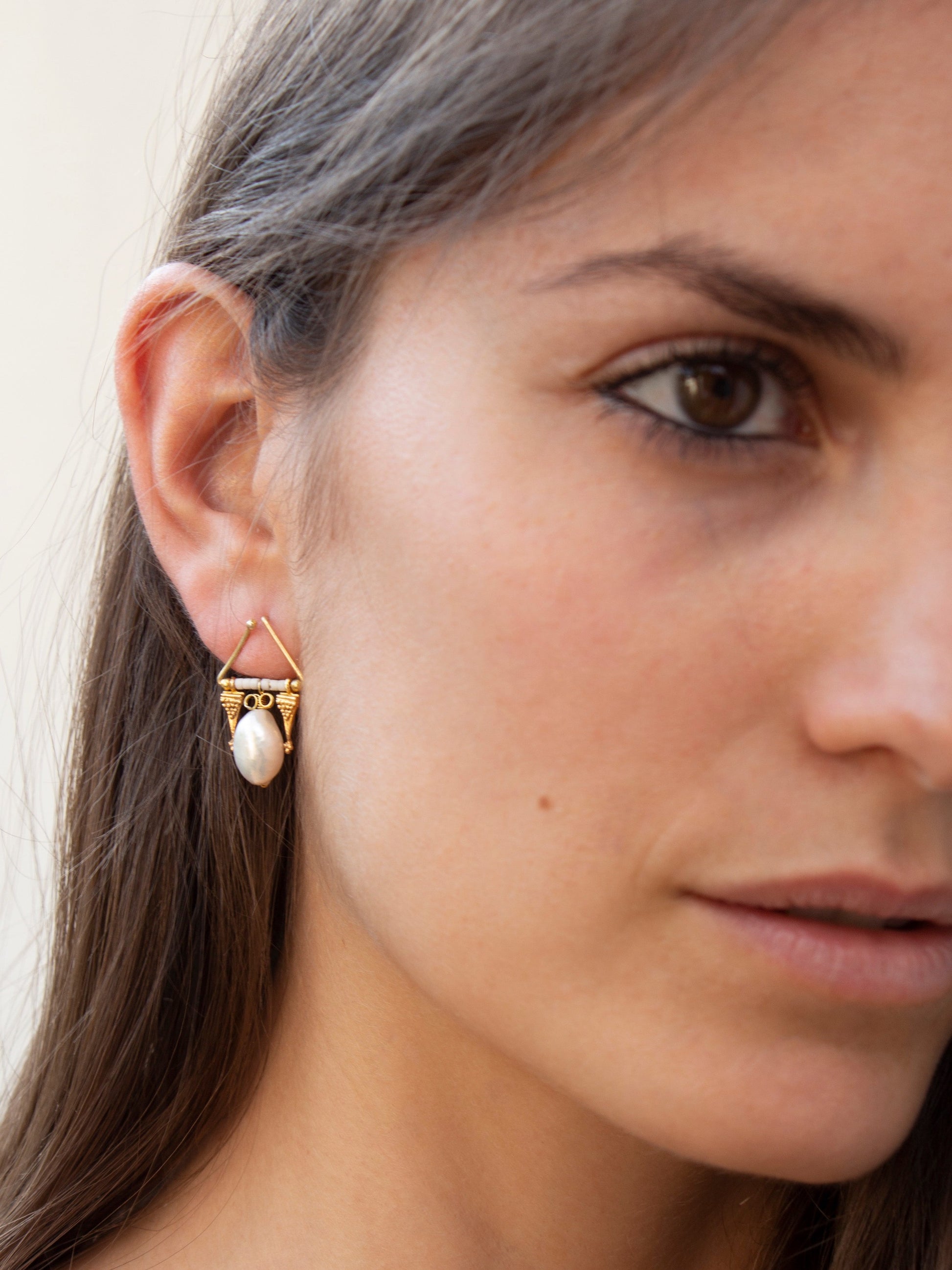 Girl wearing pearl drop Oceanids