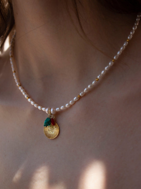 Elegant pearl necklace with turquoise, coral and gold coin pendant