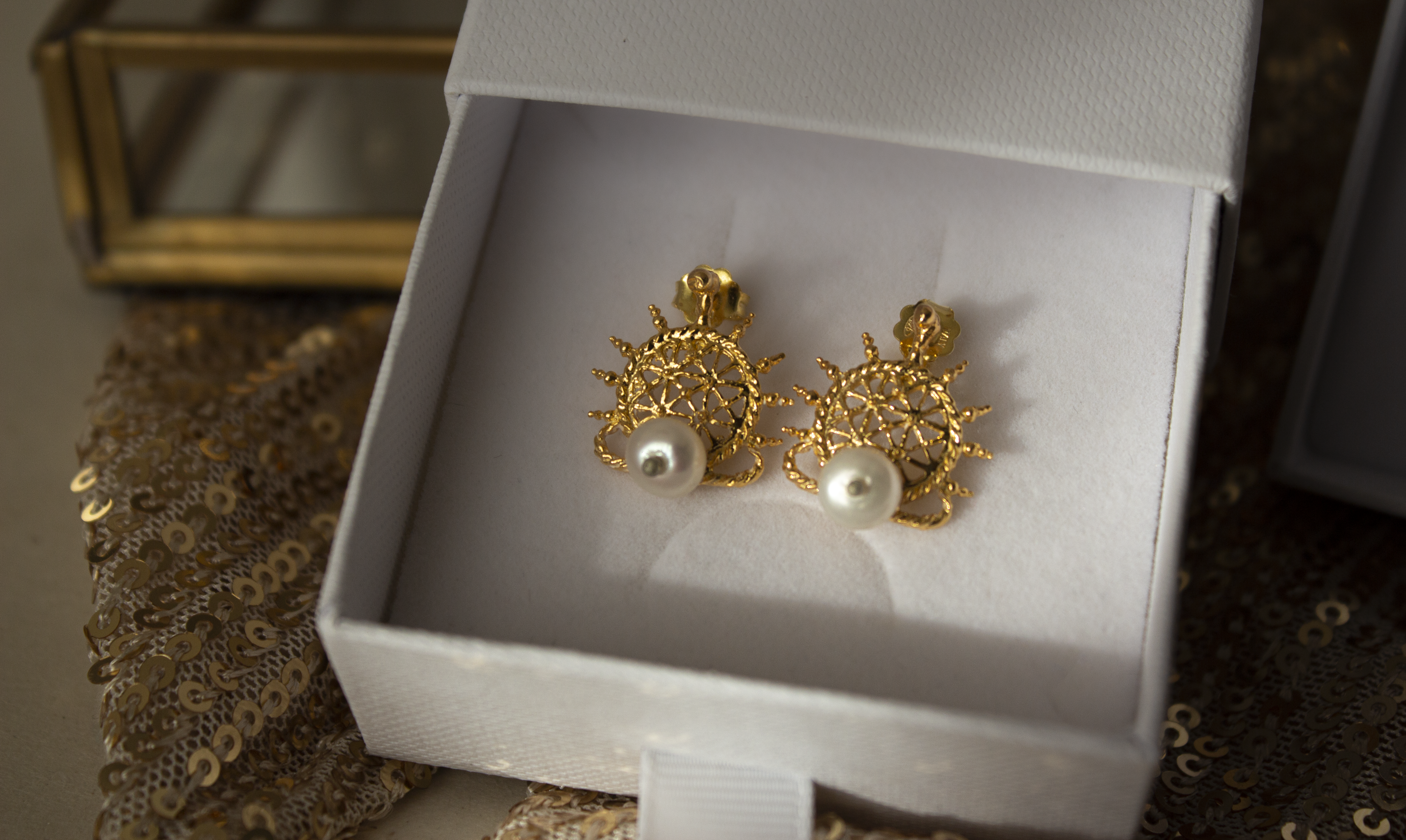 Gold earrings in small, simple lightweight designs