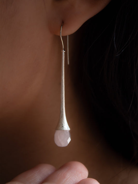 Sabiria's long silver earrings with briolette cut light pink quartz gemstone